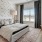 a bedroom with a large window