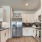 a kitchen with white cabinets