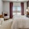 a bedroom with a large window