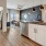 a kitchen with white cabinets