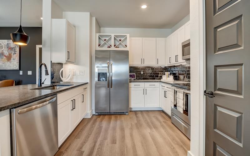 a kitchen with white cabinets